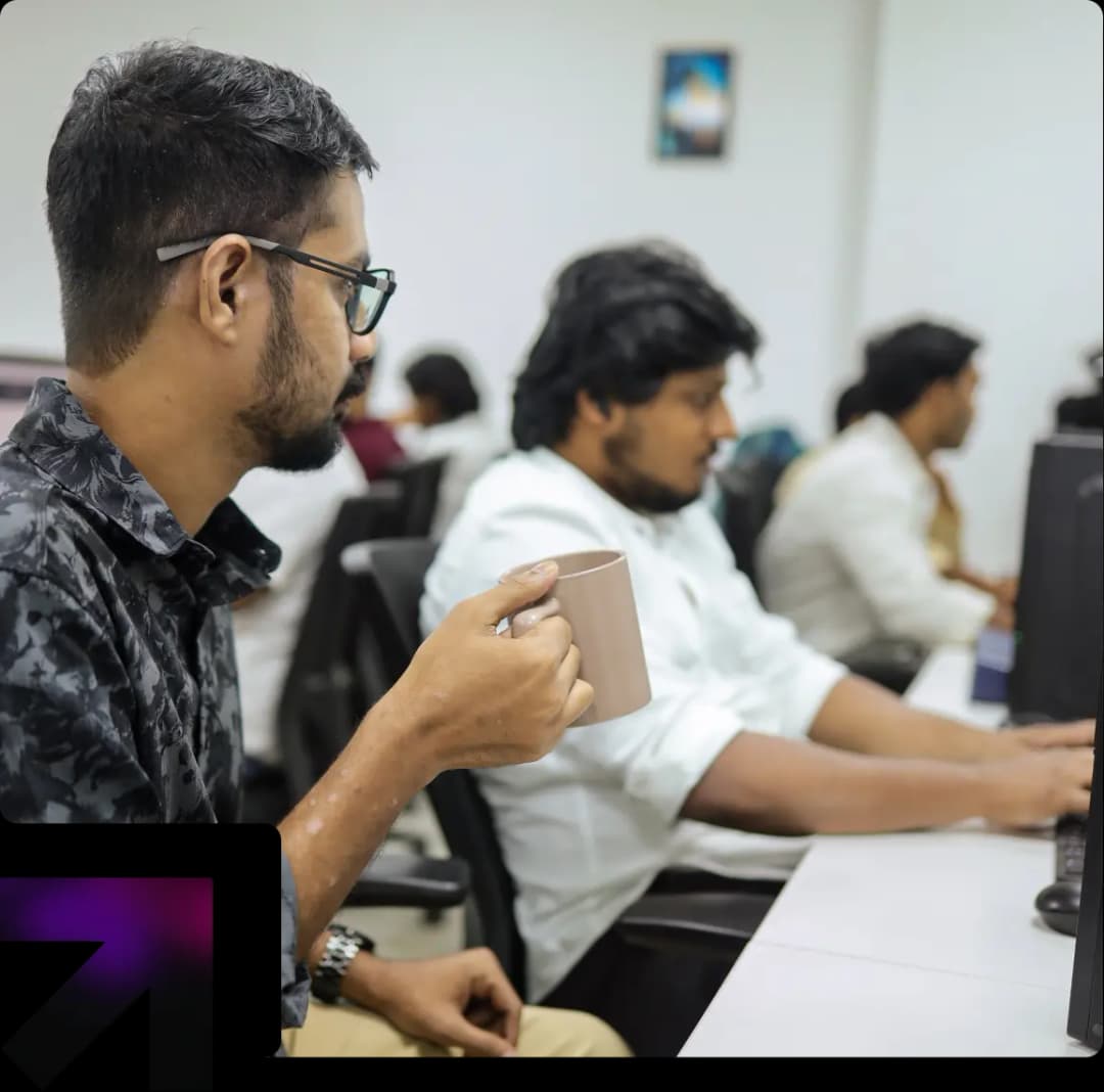 Aventus team member working on AI software development in a collaborative office environment.